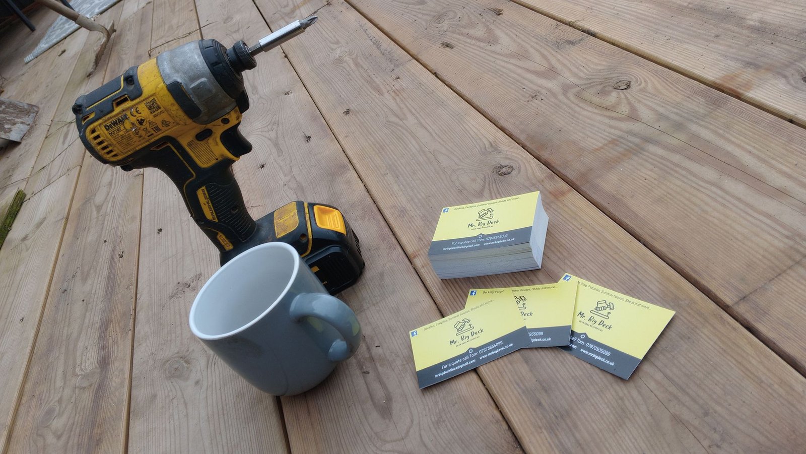 Drill, mug and business cards